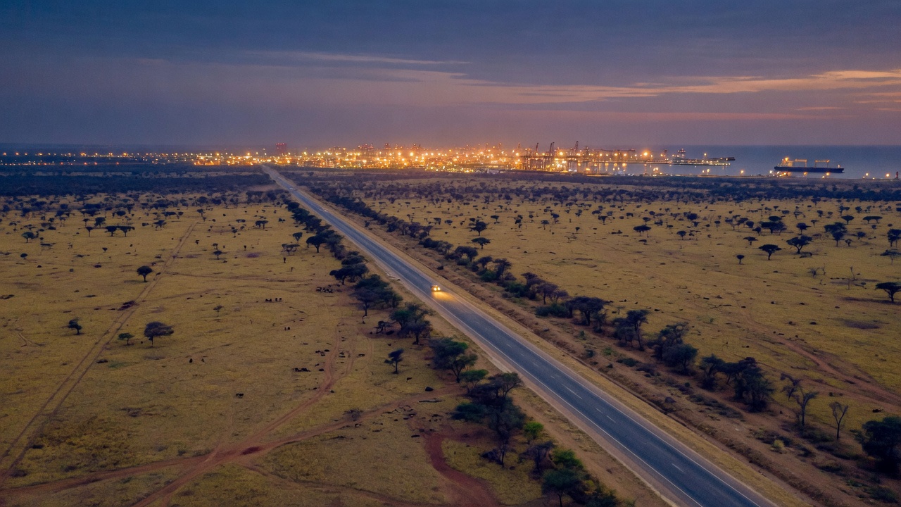 Highway corridor toward a distant port.
